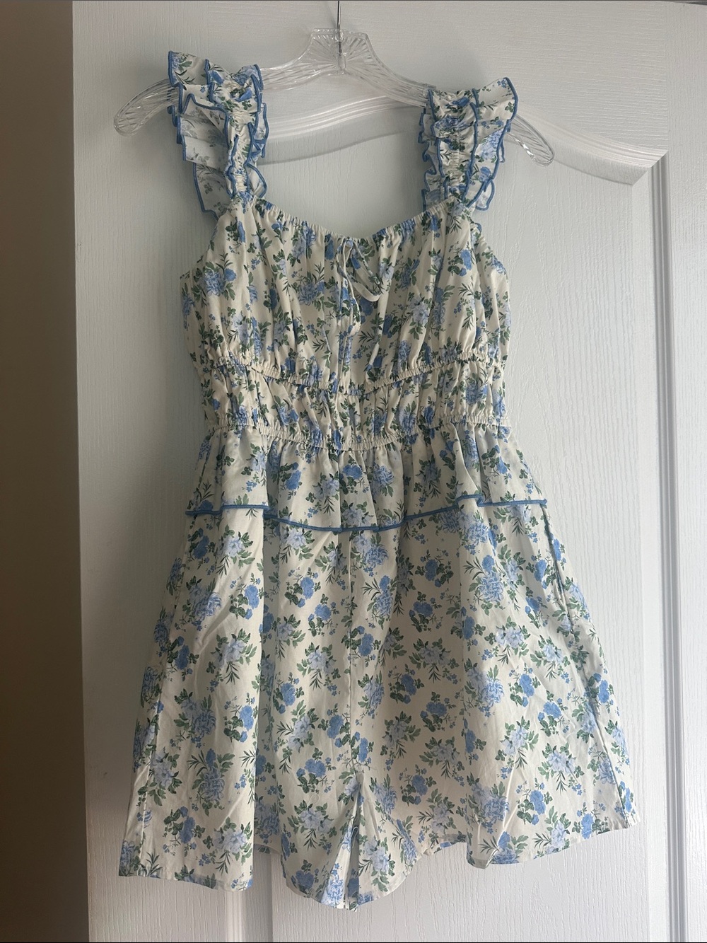 NWOT women’s blue floral romper size small